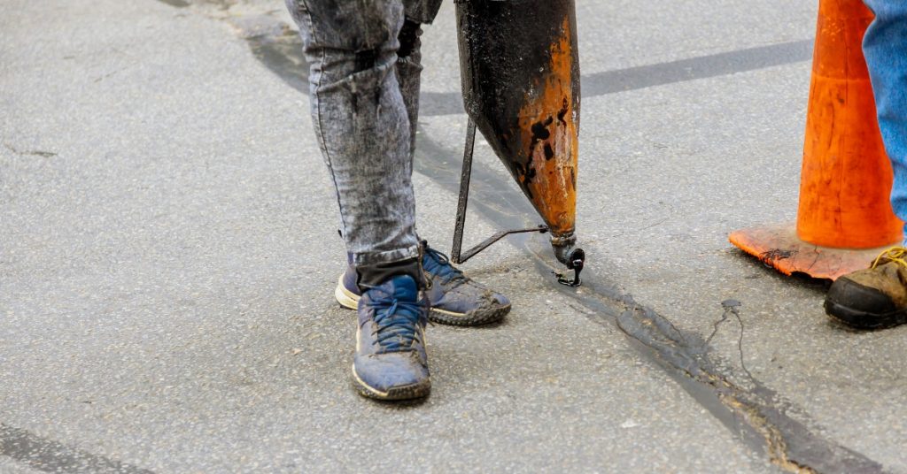 What is the Difference Between Asphalt Crack Filling vs Crack Sealing?